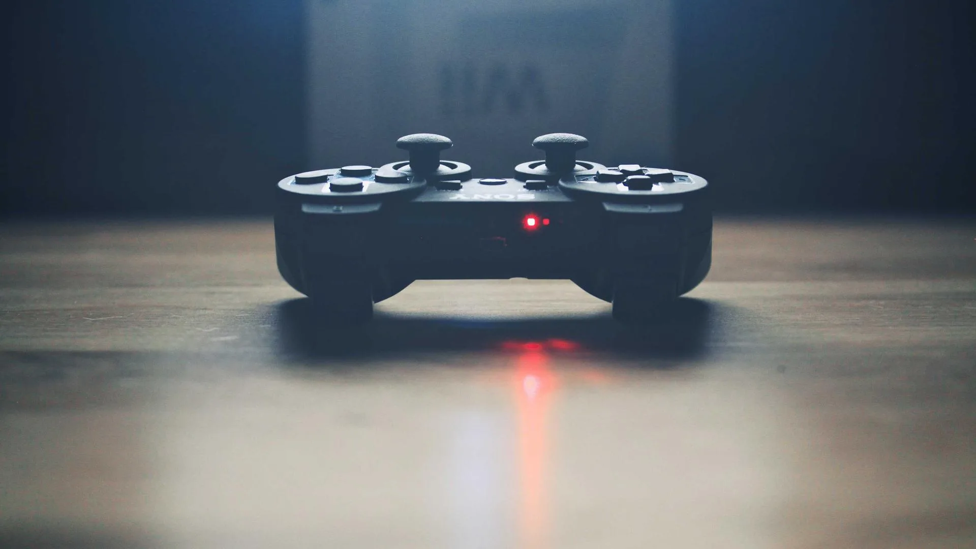 Game controller lit by a red indicator light